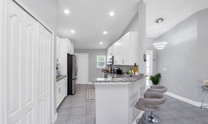 Poinciana House | THE MODERN OASIS - SPACIOUS 4 BDRM VACATION HOME. MINS. FROM DISNEY.