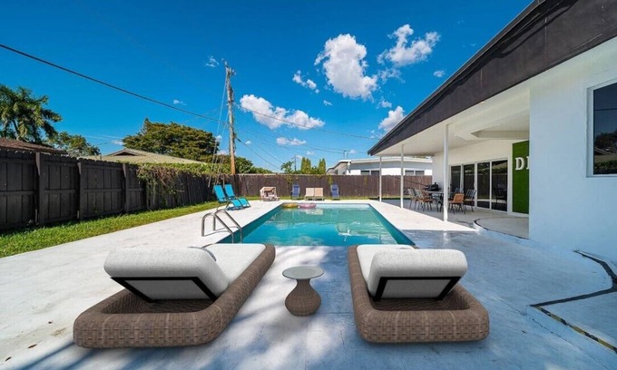 Ojus House | The modern villa with heated pool.