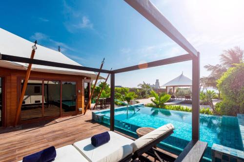 Al Hamra Village Resort | The Ritz-Carlton Ras Al Khaimah, Al Hamra Beach