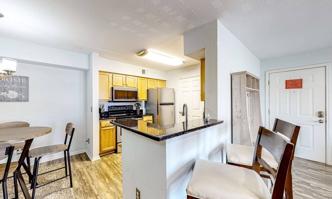 Indian Bayou Condo | Third-floor condo with balcony, pool, gym & central AC - 1/2 mile to the beach
