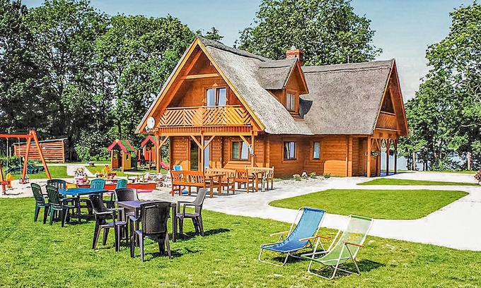 gmina Wolin House | This beautiful, well-maintained wooden house is located on a large, fenced lot.