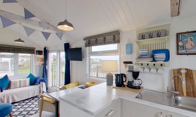 Hayle Apartment | This snug chalet is just a short walk from three miles of sandy surf.