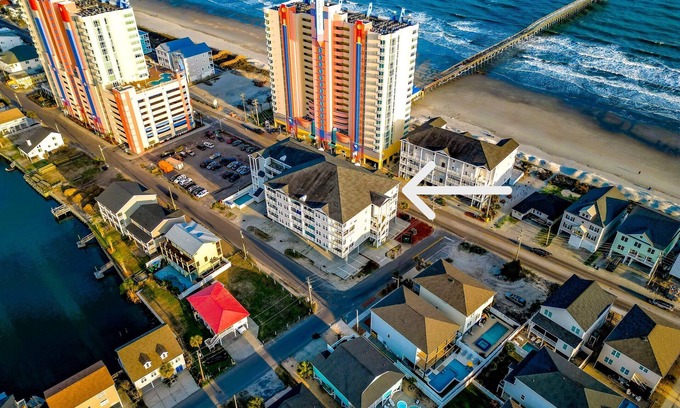 Cherry Grove Beach Condo | Tiki Time - steps to beach, pool, spa, game room, bar, ocean views