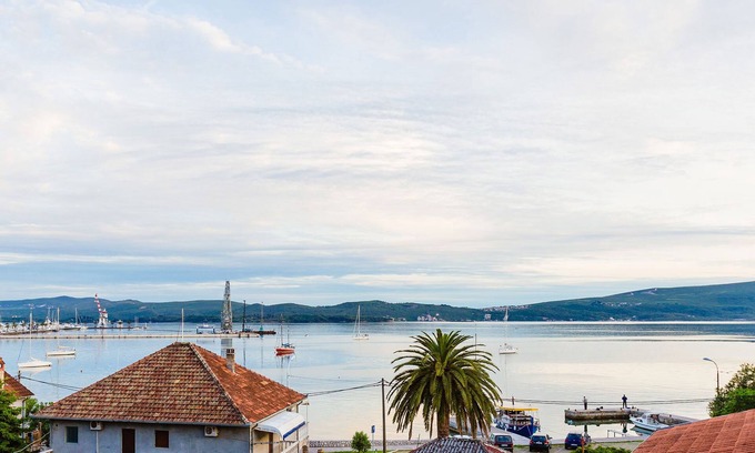 Tomicici Apartment | Top-Floor Apartment: Stunning Sea Views Steps from the Beach