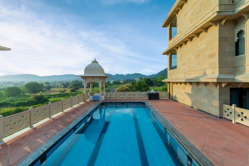 Udaipur District Resort | Traavista Aravali Mahal - Luxury Lake View Heritage Resort in Udaipur