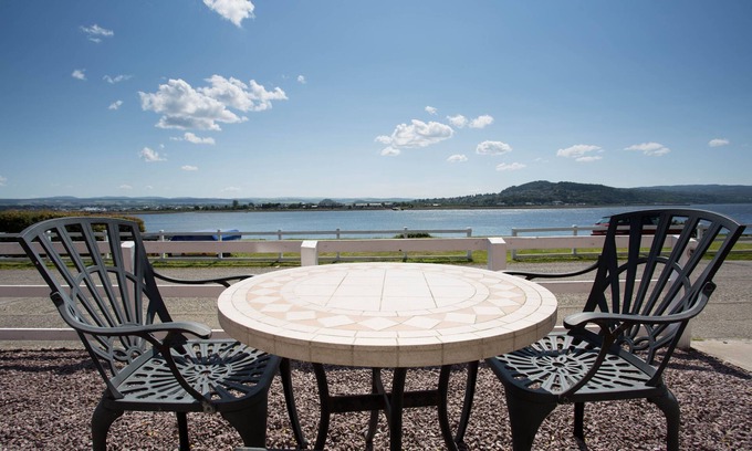 Inverness Cottage | Traditional stone built cottage, beautifully renovated,uninterrupted Sea view
