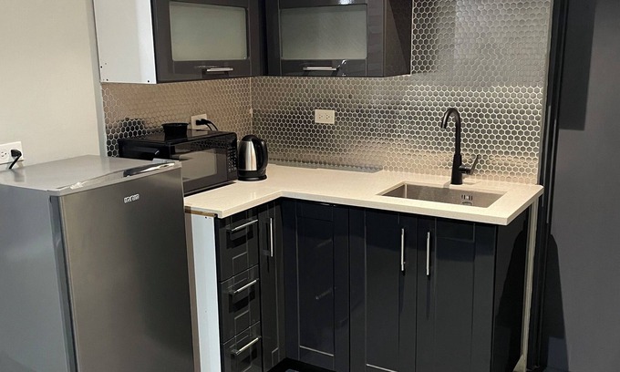 Downtown Apartment | Tranquility Hotel Suite RB, walking distance to the QPS, Ariapita Ave, & EV Zoo,
