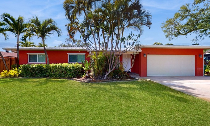 Cocoa Isles House | Tropical home with pool, lovely patio & game room - walk to beach