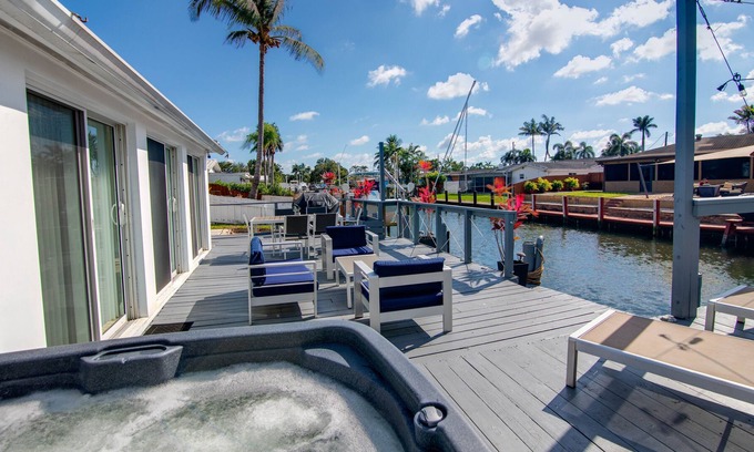 Melaleuca Gardens House | Tropical home with panoramic view of the canal. Fishing getaway near the ocean!