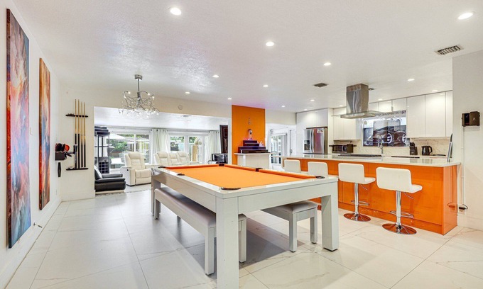 Nautilus Isle House | Tropical water front 2-bedroom 3 king beds house with heated pool & Sauna