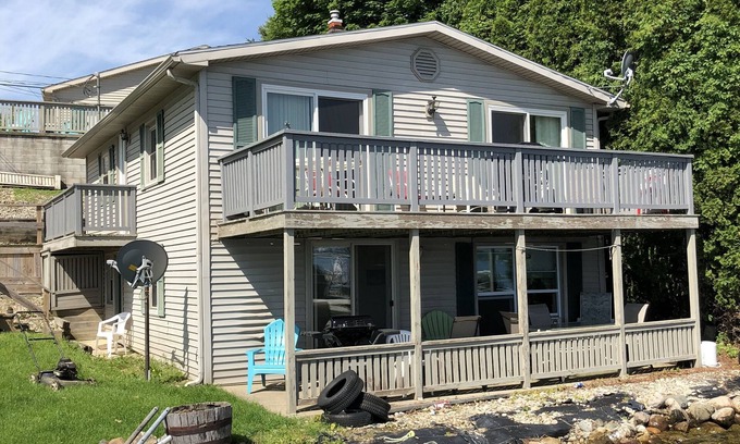 Manitou Beach-Devils Lake Cottage | Two Bed Rooms with a sunrise lakefront view