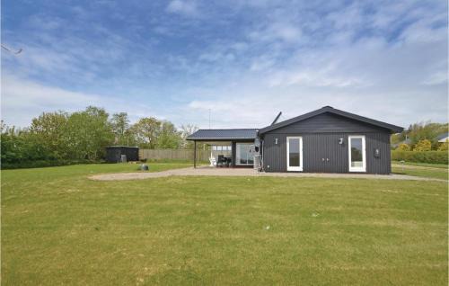 Remmer Strand House | Two-Bedroom Holiday Home With A Fireplace In Struer
