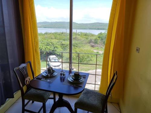 Hellshire Apartment | Two bedroom. Walk to beach. Free Wi-Fi & free parking