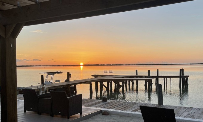Alice Town Cottage | Unique, authentic, exquisite waterfront cottage with a dock.