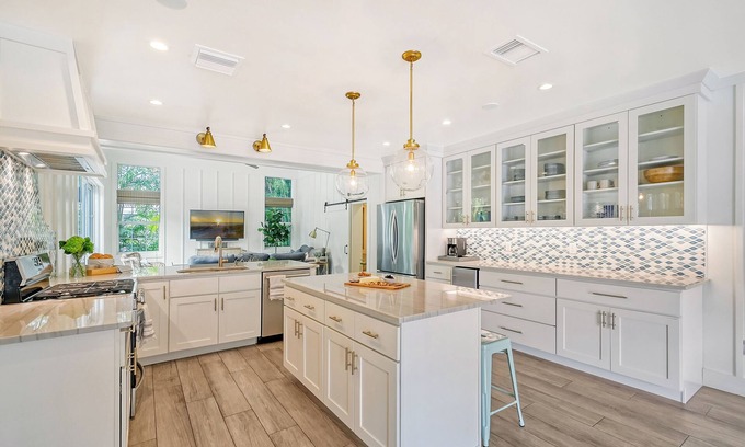 Holmes Beach House | Unwind Sunshine - heated pool, steps to the local's favorite beach, free bikes
