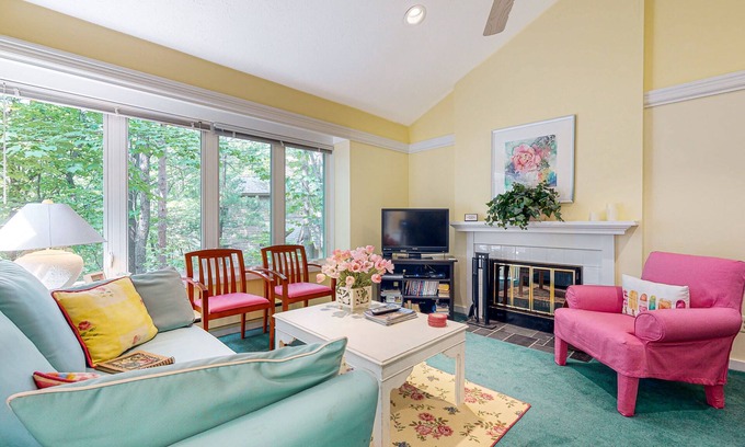 Maple City Condo | Upper-level condo with forest views, fireplace, soaking tub & high-speed WiFi