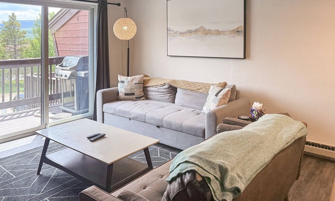 Fraser Condo | Upscale loft condo with fireplace, balcony, pool, hot tub & W/D