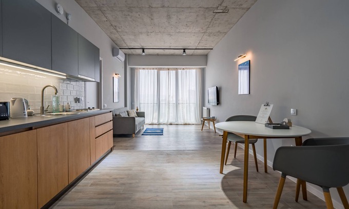 Vake Condo | Urban Loft Apt Ideal for Workcation, Couples & Families