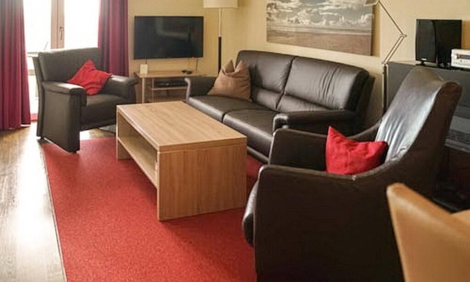 Wremen Apartment | Vacation apartment near the beach with sauna, balcony with beach chair and wonderful view