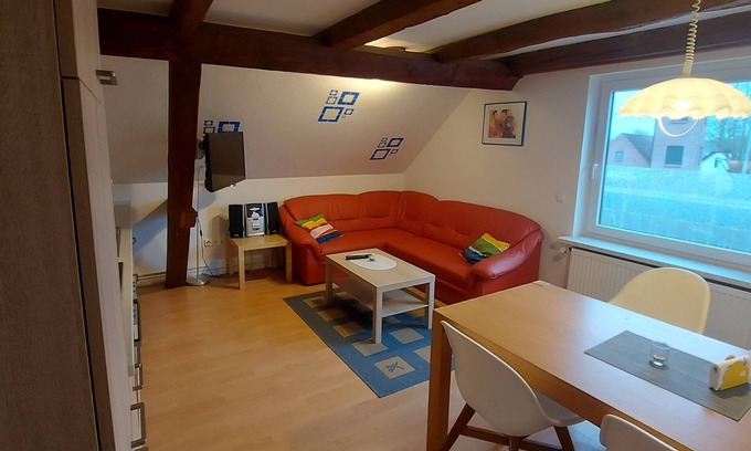 Eckwarden Apartment | Vacation home Herter, WiFi, garden, play equipment, lounger/play area, barbecue