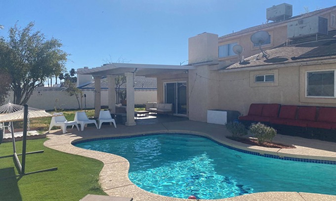 Paradise House | Vegas Oasis 4BR Pool + Patio Near Strip & Airport