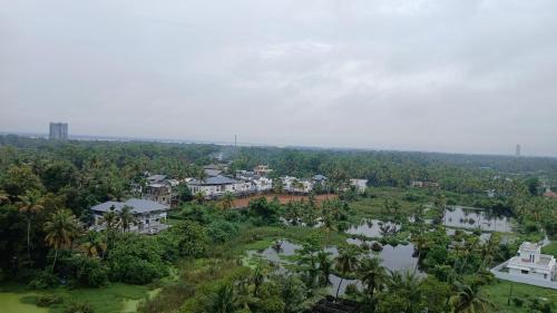 Kumbalam Apartment | Veu Ragamalika Apartment with Fully Equipped Kitchen, Balcony & Caretaker