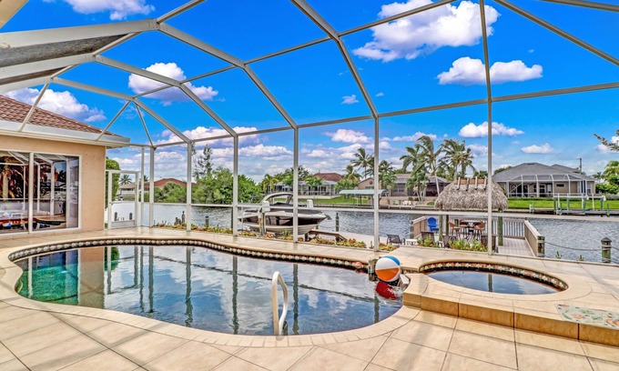 Pelican House | Villa Blue Water 1022 SW Cape Coral 4b 3ba luxury home electric heated pool and spa