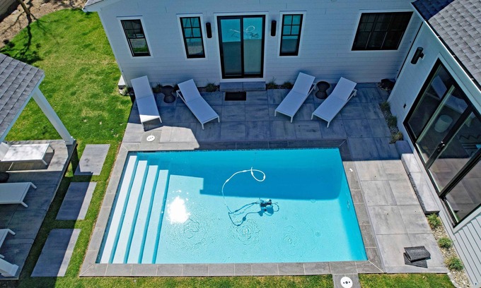 South Rehoboth House | Villa Rehoboth - 5 master suites, salt-water pool, cinema. In-town location.