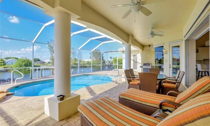 Pelican House | Villa Starlight 1036 SW Cape Coral 3b 3ba Heated Pool and Spa Gulf Access Canal, Boat Dock Tiki Hut
