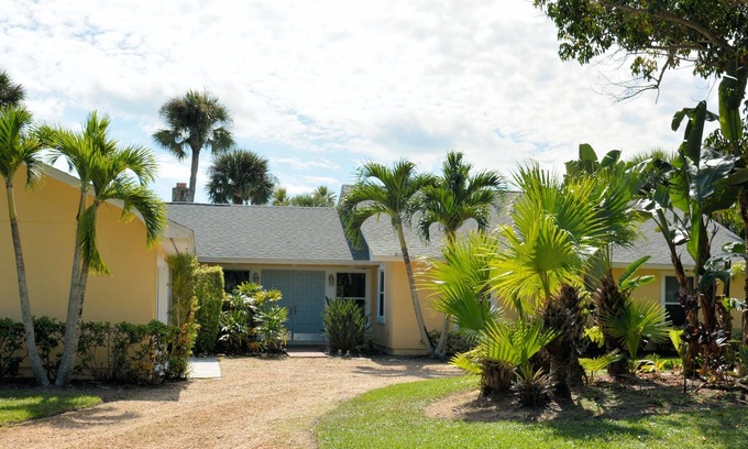 South Beach House | Walk to private beach Heated pool Kayaks bikes quiet tropical back yard