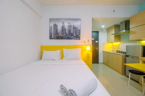 Depok Apartment | Warm and Cozy Studio Park View Condominium Apartment By Travelio