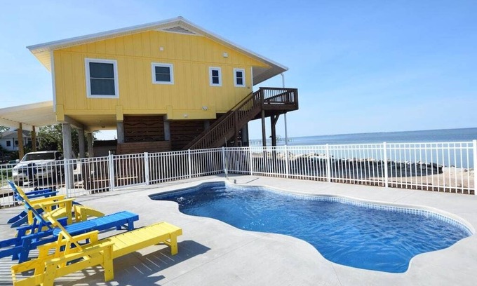 St. George Island House | Water front and side! Pool, Hot Tub, Dock, Game room, Fenced Yard, Dog friendly