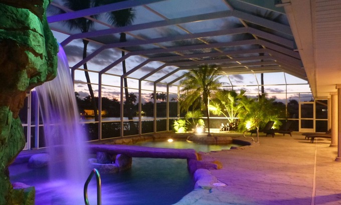 Yacht Club House | Water-park style pool with hot tub in grotto w. waterfall + bridge over pool