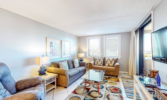 Holiday Isle Condo | Water-view condo with heated pool, hot tub, sports courts & on-site beach access