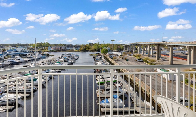 North Myrtle Beach Condo | Waterfront condo with pool, hot tub, amazing view, W/D, & AC - one mile to beach