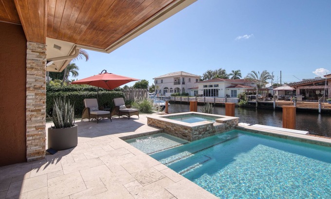 Pompano Isles House | Waterfront charmer with dock access, pool, hot tub, children's items, and W/D