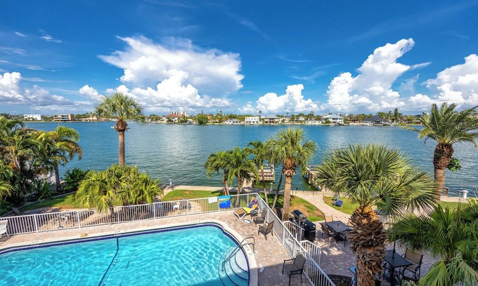 Treasure Island Condo | Waterfront Condo Pool Fishing Docks Across from the Beach