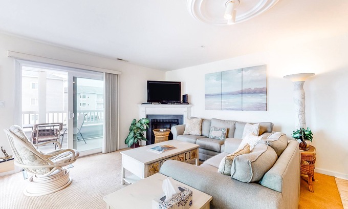 Ocean City Condo | Waterfront condo with pool, balcony, fireplace, central AC, & washer/dryer