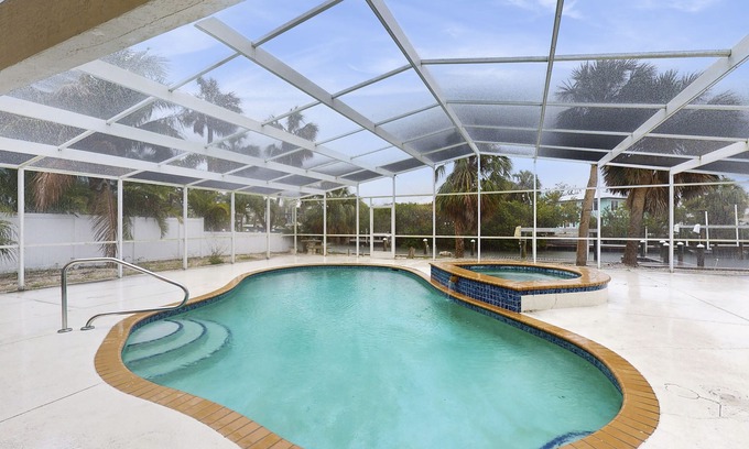 Anna Maria House | Waterfront dog-friendly home with heated private pool, dock, views, and lanai