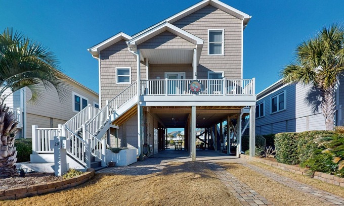 Ocean Isle Beach House | Waterfront home near the beach with outdoor gathering areas, pools & piers