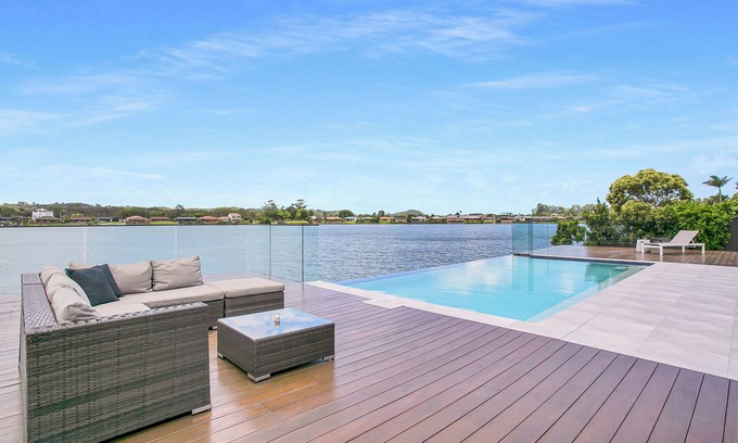 Elanora House | Waterfront Retreat with Infinity Pool & Canal Views