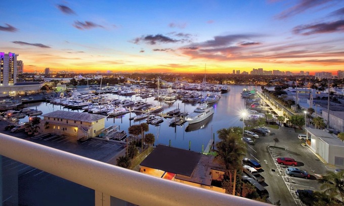 Central Beach Hotel | Waterfront Sanctuary: Marina Balcony, Pool, Easy Access to Water Taxi