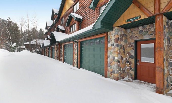 Eagle River House | Waterfront townhome with fireplace, private patio, & shared boat docks