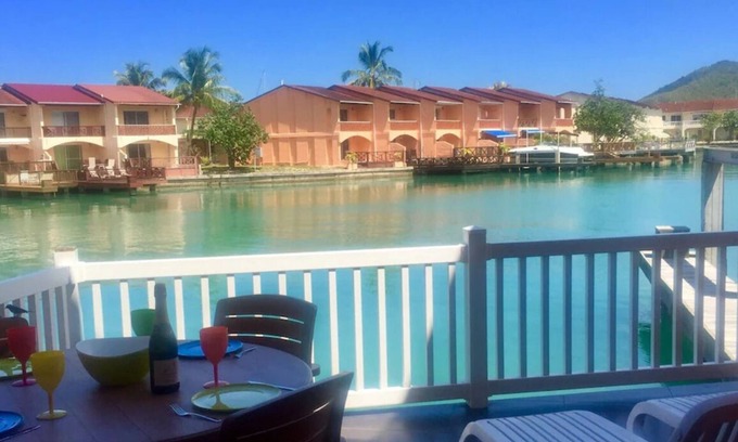 Jolly Harbour Villa | Waterfront two bed villa 3 mins walk to stunning Beach, air con and balcony