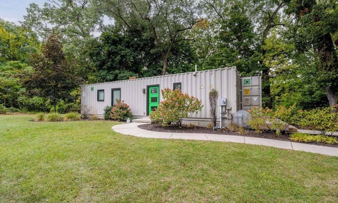Benton Harbor Apartment | Welcome to a one-of-a-kind getaway in this modern and thoughtfully designed container home. Nestled in a quiet, wooded lot within Benton Harbor, the home offers a peaceful retreat just minutes from the beaches of Lake Michigan and charming shops