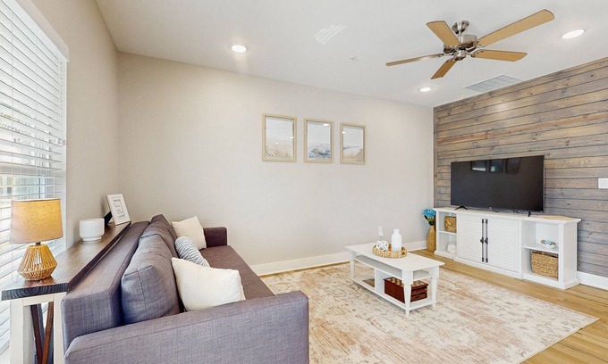Fulton House | Welcoming coastal home with shared pool, stocked fishing pond - kitchen & patio