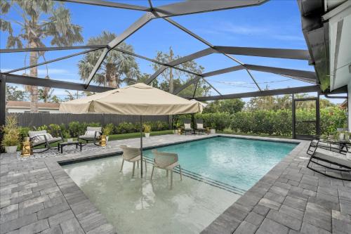 Naples Park House | Your Vacation Oasis - Private Pool Bike to Beach