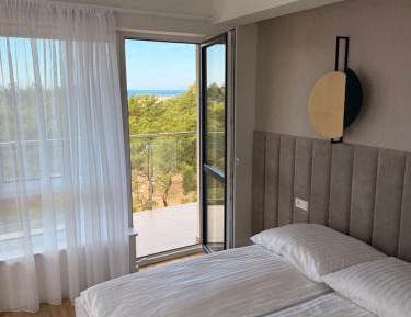 One-Bedroom Apartment with Balcony and Sea View