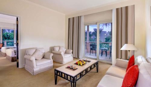 One-Bedroom Prestige King Suite with Balcony and Garden View