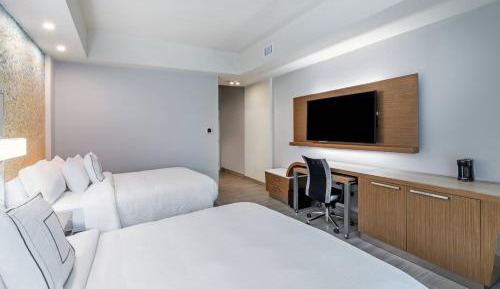 Larger Guest room, 2 Queen, Sofa bed, Partial ocean view